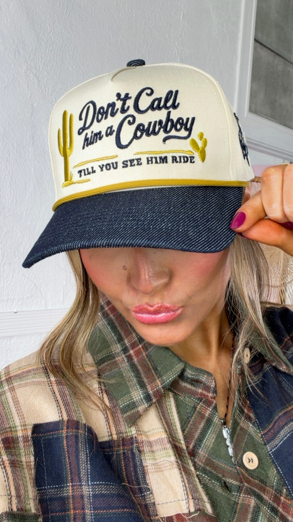 Don't Call Him A Cowboy Trucker Hat