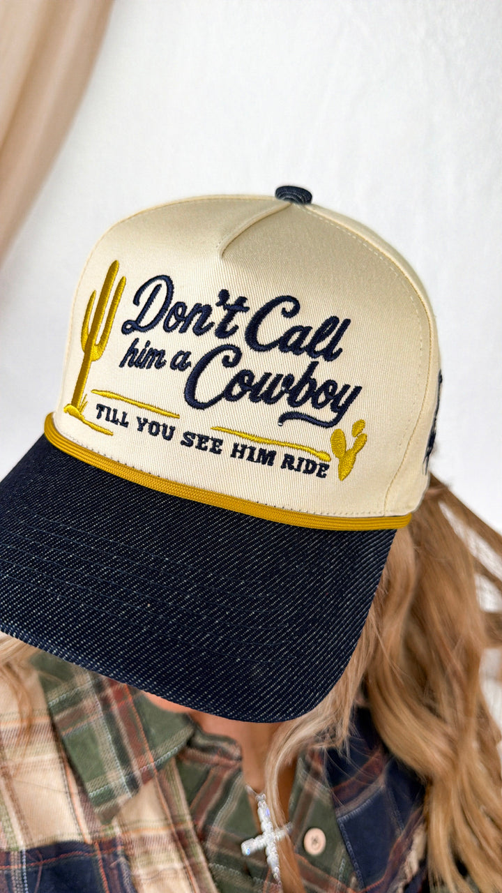 Don't Call Him A Cowboy Trucker Hat